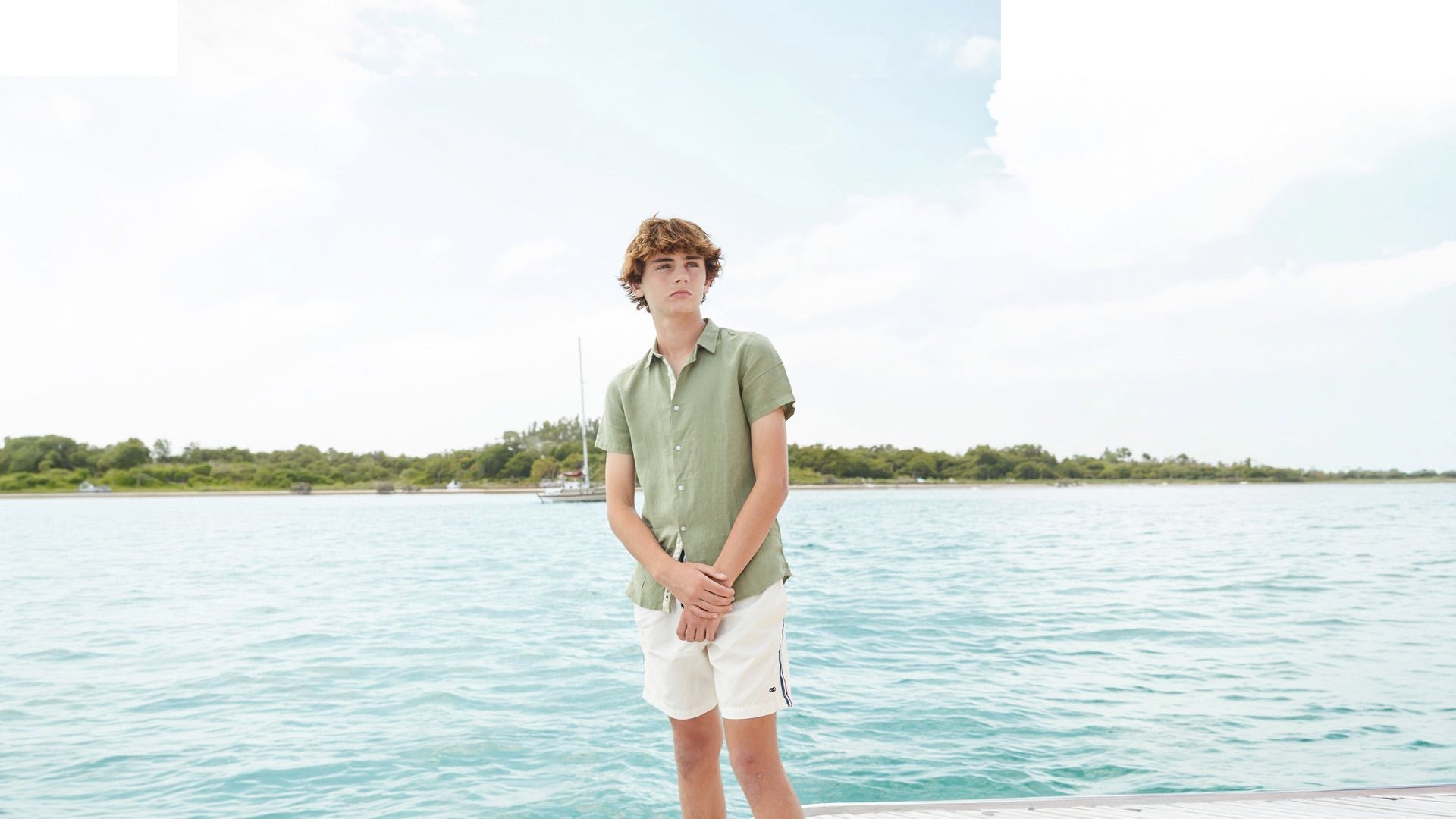 boy wearing a linen green shirt