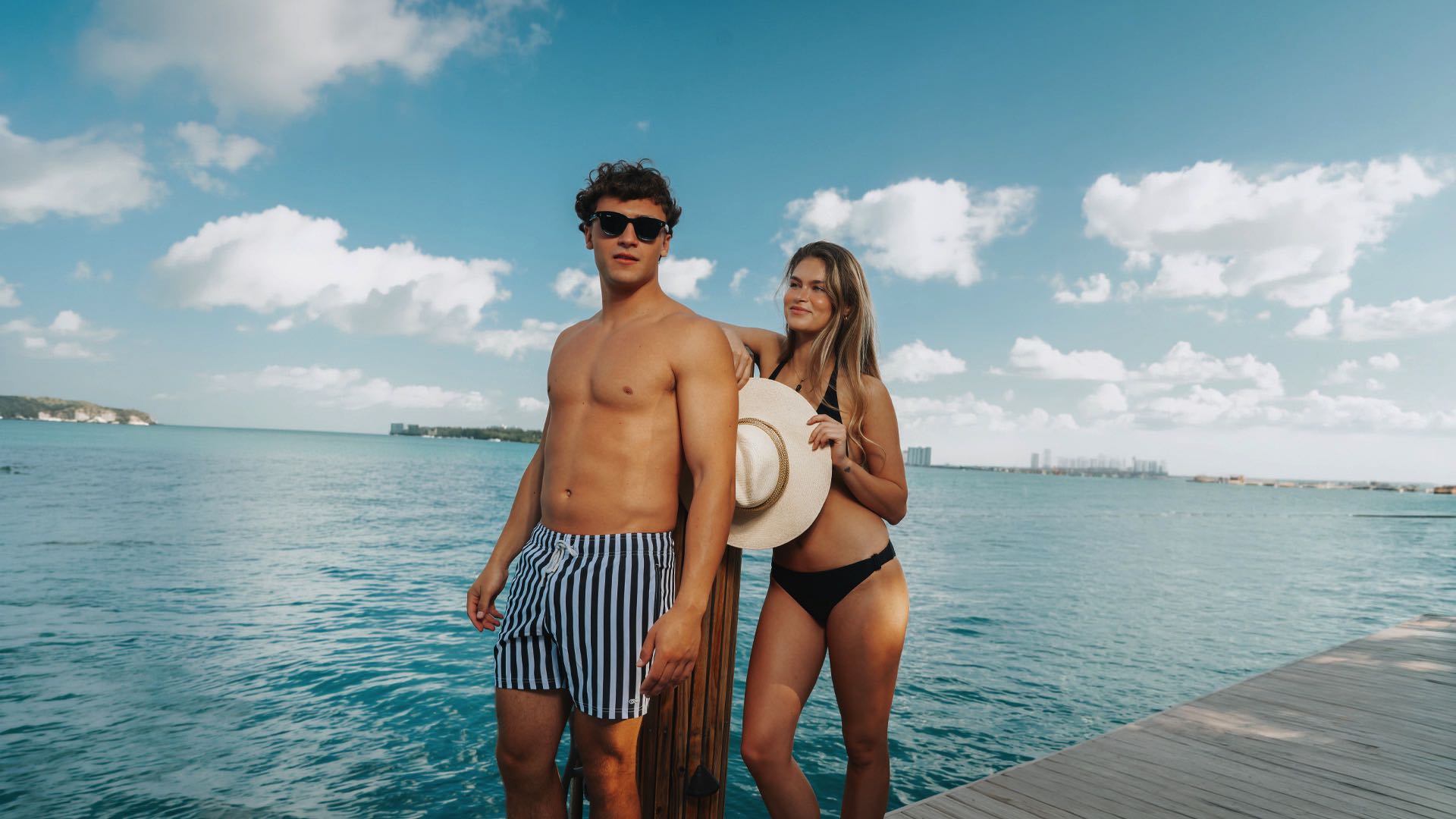 Men and Woman at a port wearing Le Club resortwear 