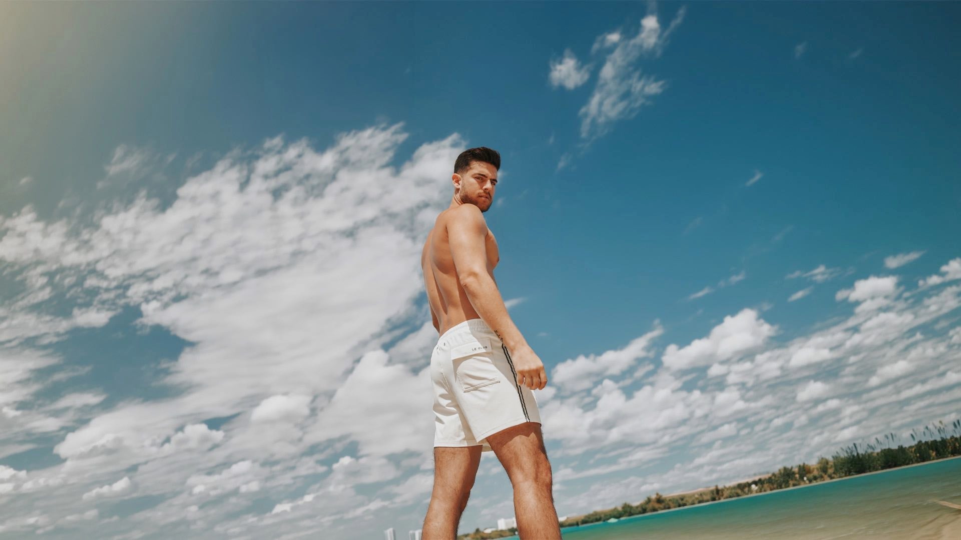 men wearing an hybrid swim trunk with compression liner