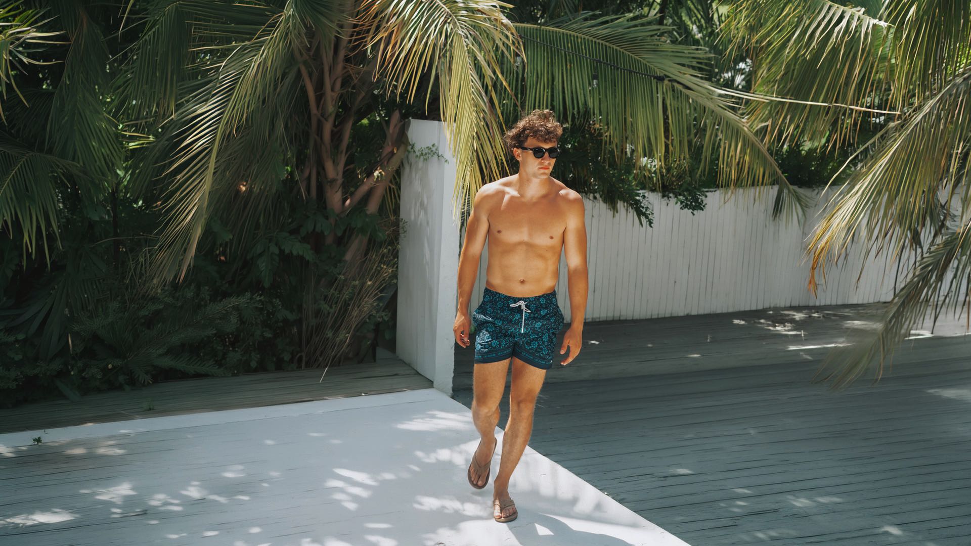 men wearing teal spring swim trunk