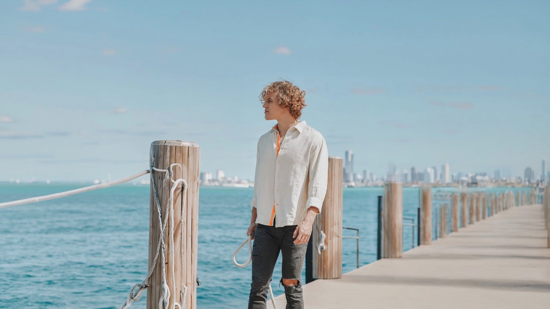 men wearing a linen shirt at a port