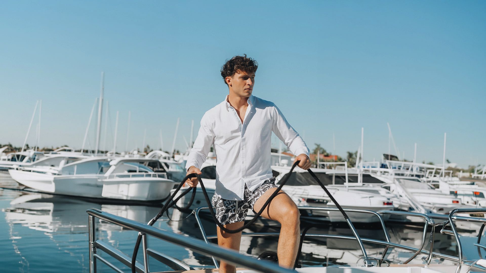 men wearing an oxford cotton shirt at the boat