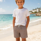 Boy wearing geo brown style at the beach 
